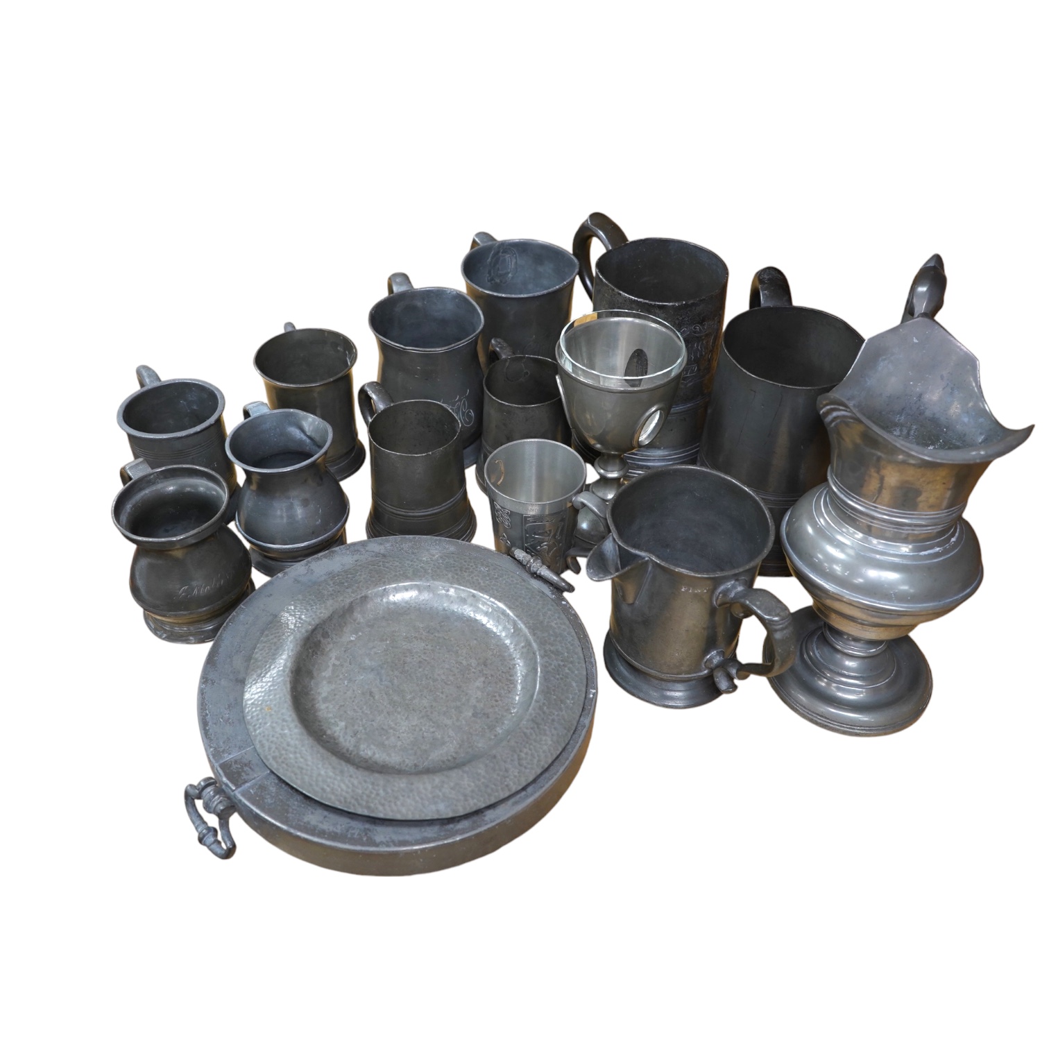A collection of various pewter tankards, jugs etc. Condition - varies